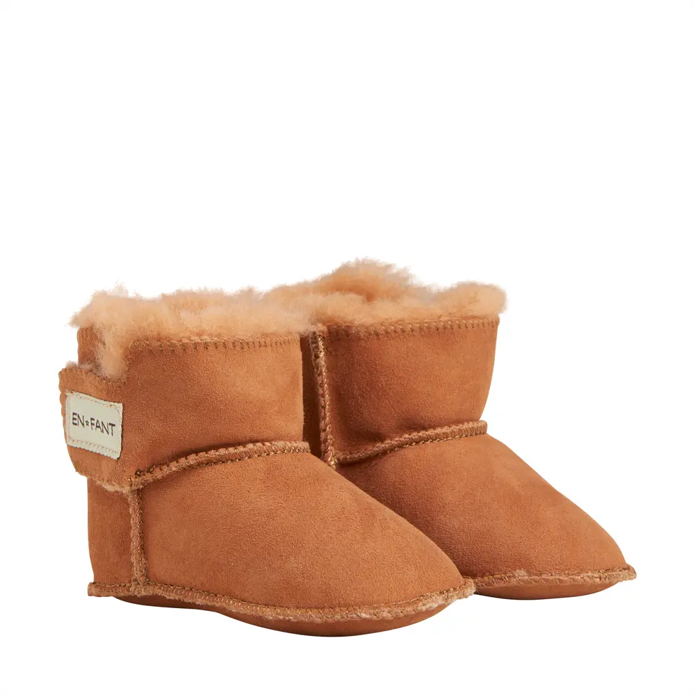 Lækre lammeskindsfutter fra En Fant - Hold fødderne varme!